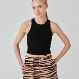 Basic top cut from a soft ribbed jersey fabric. IgorMD crop top in the color Black is styles with a slim fit and cropped fit with racer-shaped back. Perfect for a sporty look. The model is 173 cm and wears a size S/36