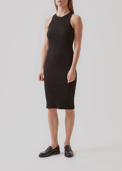 Basic dress in a soft ribbed cotton fabric. IgorMD dress is a slim-fitted style with racer back. Perfect to style for a sporty and relaxed look. The model is 173 cm and wears a size S/36  Material: 95% Cotton 5% Elastane