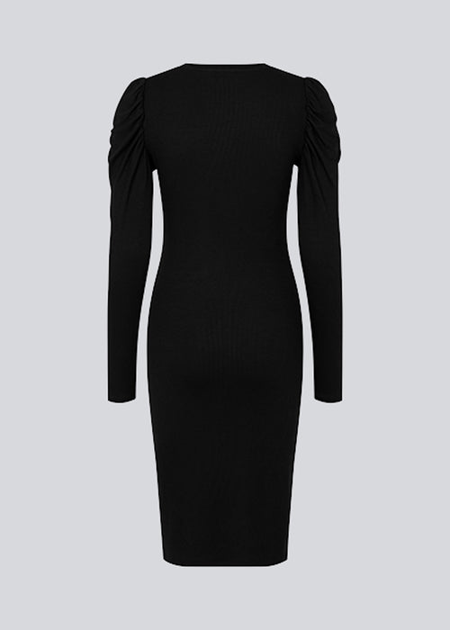 Dress in rib knit with long puff sleeves and a round neck. The quality of KrownMD puff dress is stretchy and more responsible.