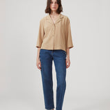 Shirt in beige in a relaxed silhouette and 3/4 length sleeves. AaliyahMD shirt has a resort collar, dropped shoulders and button closure in front.