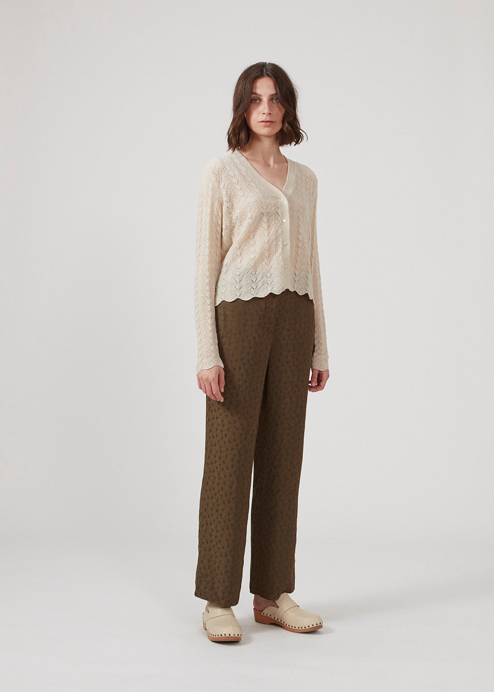 Wide-legged pants in the color Dark Forest in a patterned satin. CarmelMD pants have a medium waist with zip-fly, button closure, and elastic in the back for extra comfort. The model is 177 cm and wears a size S/36.  Shop matching shirt: CarmelMD shirt.
