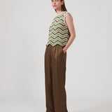 Satin pants in a classic look. CarwynMD pants are designed with wide legs, pleats in front, and hidden closure with zip fly and clasp. The model is 174 cm and wears a size S/36.