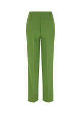 Classic pants with pressfolds and straight legs. Nelli pants are closes by an hidden zipper at the side with an elastic waistband for a more comfortable fit. The model is 173 cm and wears a size S/36