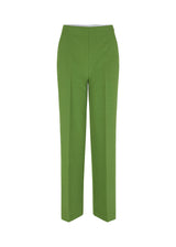 Classic pants with pressfolds and straight legs. Nelli pants are closes by an hidden zipper at the side with an elastic waistband for a more comfortable fit. The model is 173 cm and wears a size S/36