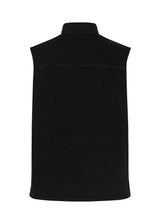 Cool vest in organic cotton. Nour vest has a boxy fit, which is easy to style over a t-shirt, shirt, or a dress for adding a cool element to the look. The vest is closed with buttons at the front. The model is 173 cm and wears a size S/36