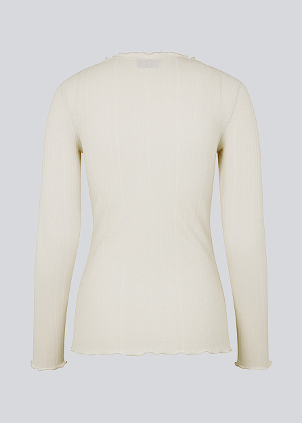 Tight-fitted, beige long sleeved t-shirt with ruffled trimmings on sleeves, at the neck and bottom. Oasis t-neck fits perfectly as a basic style in the wardrobe. 