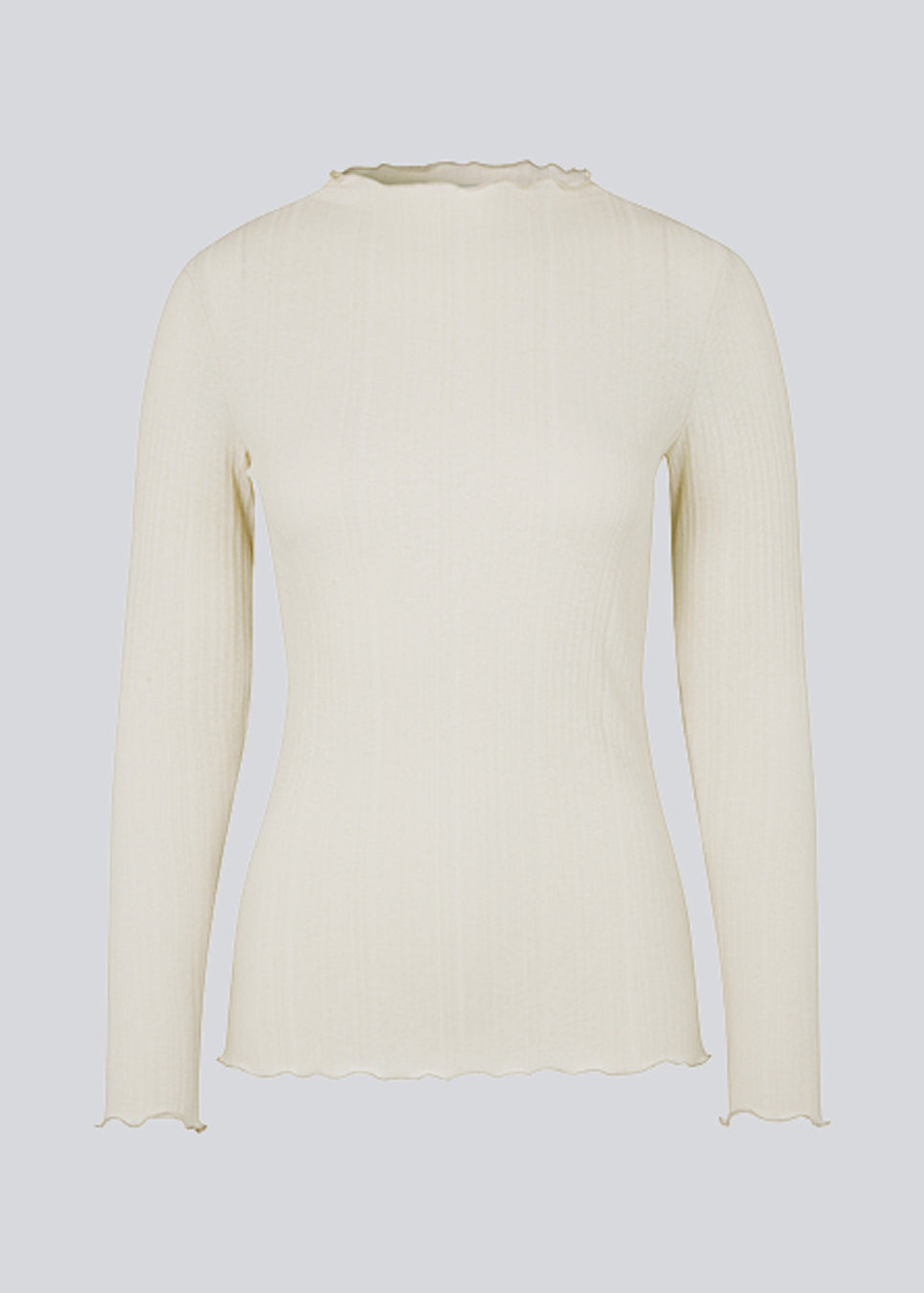 Tight-fitted, beige long sleeved t-shirt with ruffled trimmings on sleeves, at the neck and bottom. Oasis t-neck fits perfectly as a basic style in the wardrobe. 