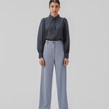 Classic shirt in dark blue in a light and airy material. Oskar shirt has a relaxed fit with voluminous balloon sleeves finished with a wide cuff. The shirt is a bit sheer for an ultra-feminine expression. The model is 174 cm and wears a size S/36.