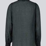 Classic shirt in dark blue in a light and airy material. Oskar shirt has a relaxed fit with voluminous balloon sleeves finished with a wide cuff. The shirt is a bit sheer for an ultra-feminine expression. The model is 174 cm and wears a size S/36.