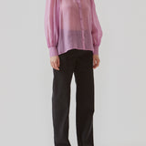 Classic shirt in a purple, light and airy material. Oskar shirt has a relaxed fit with voluminous balloon sleeves finished with a wide cuff. The shirt is a bit sheer for an ultra-feminine expression.