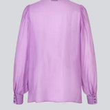 Classic shirt in a purple, light and airy material. Oskar shirt has a relaxed fit with voluminous balloon sleeves finished with a wide cuff. The shirt is a bit sheer for an ultra-feminine expression.