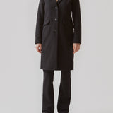 Beautiful, long wool coat in black. Pamela coat is closed by 3 big buttons at front and is waisted, which gives a feminine look. Because of the high content of wool you will be able to keep warm all through fall and the mild winters.