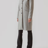Beautiful, long wool coat in grey. Pamela coat is closed by 3 big buttons at front and is waisted, which gives a feminine look. Because of the high content of wool you will be able to keep warm all through fall and the mild winters.