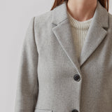 Beautiful, long wool coat in grey. Pamela coat is closed by 3 big buttons at front and is waisted, which gives a feminine look. Because of the high content of wool you will be able to keep warm all through fall and the mild winters.