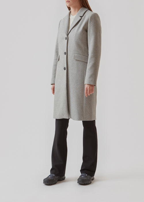 Beautiful, long wool coat in grey. Pamela coat is closed by 3 big buttons at front and is waisted, which gives a feminine look. Because of the high content of wool you will be able to keep warm all through fall and the mild winters.