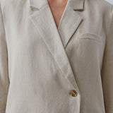 Blazer in a voluminous fit with an asymmetrical look. Park blazer in Cream Milk is made from an airy linen quality, which is easy to style with the matching pants or over a dress on a summer evening.