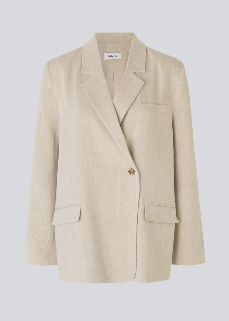 Blazer in a voluminous fit with an asymmetrical look. Park blazer in Cream Milk is made from an airy linen quality, which is easy to style with the matching pants or over a dress on a summer evening.