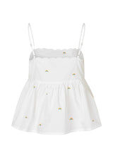 Top in light and airy organic cotton. PernilleMD strap top has adjustable spaghetti straps, scalloped trim at the top, and embroidered rainbows. The top is fitted at the top and flared peplum.