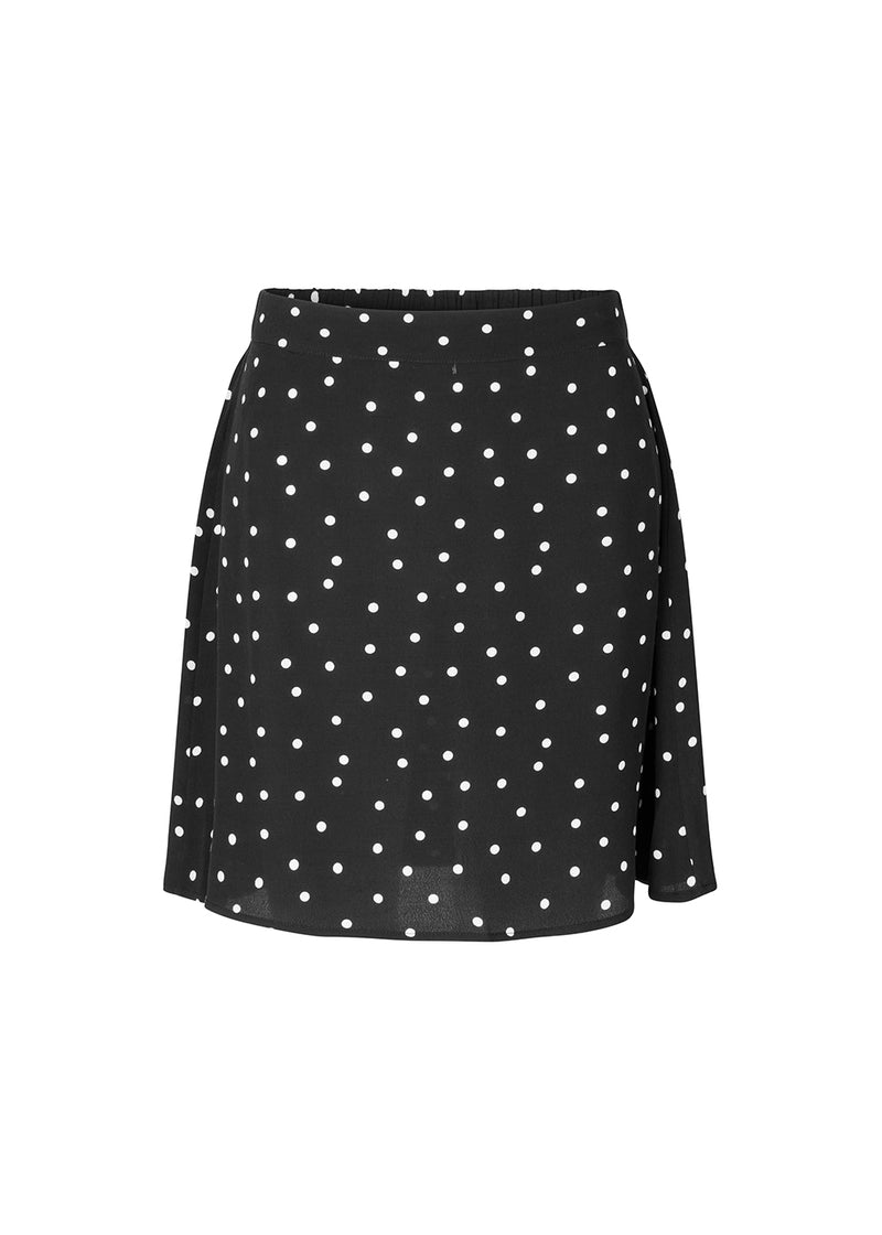 High-waisted mini skirt in black in a dotted EcoVero viscose with an airy fit. Covered elasticated waist on the back and a smooth back. The model is 173 cm and wears a size S/36