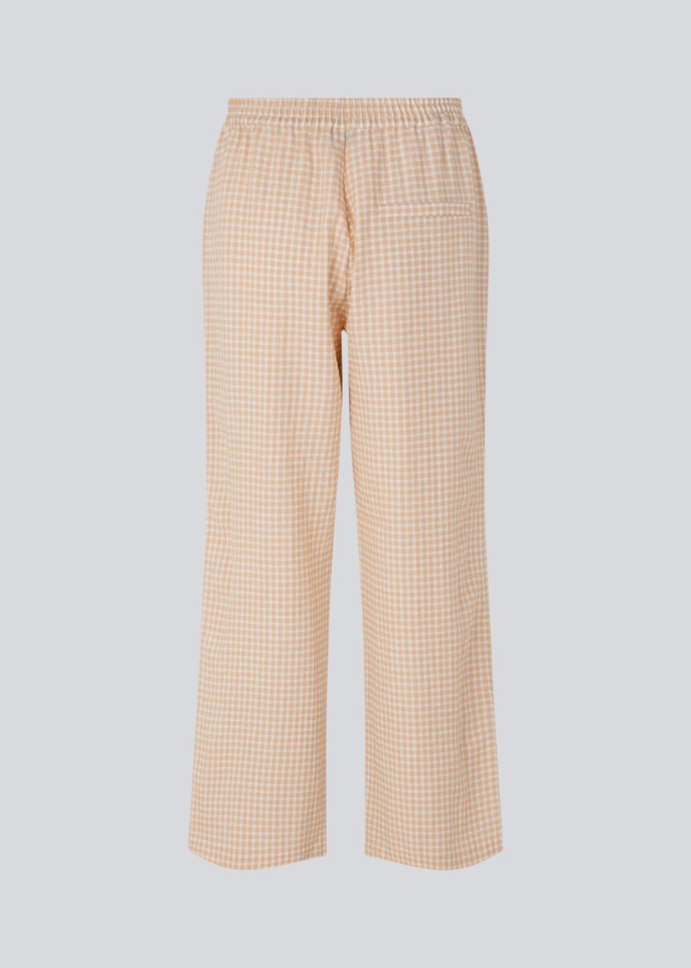 Straight, wide pants in beige in check with elasticated waist, pockets at side, and a decorative fake back pocket. The length is slightly cropped. The model is 173 cm and wears a size S/36.