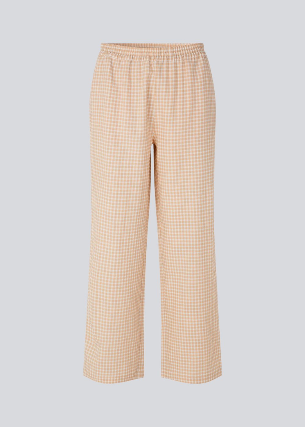 Straight, wide pants in beige in check with elasticated waist, pockets at side, and a decorative fake back pocket. The length is slightly cropped. The model is 173 cm and wears a size S/36.