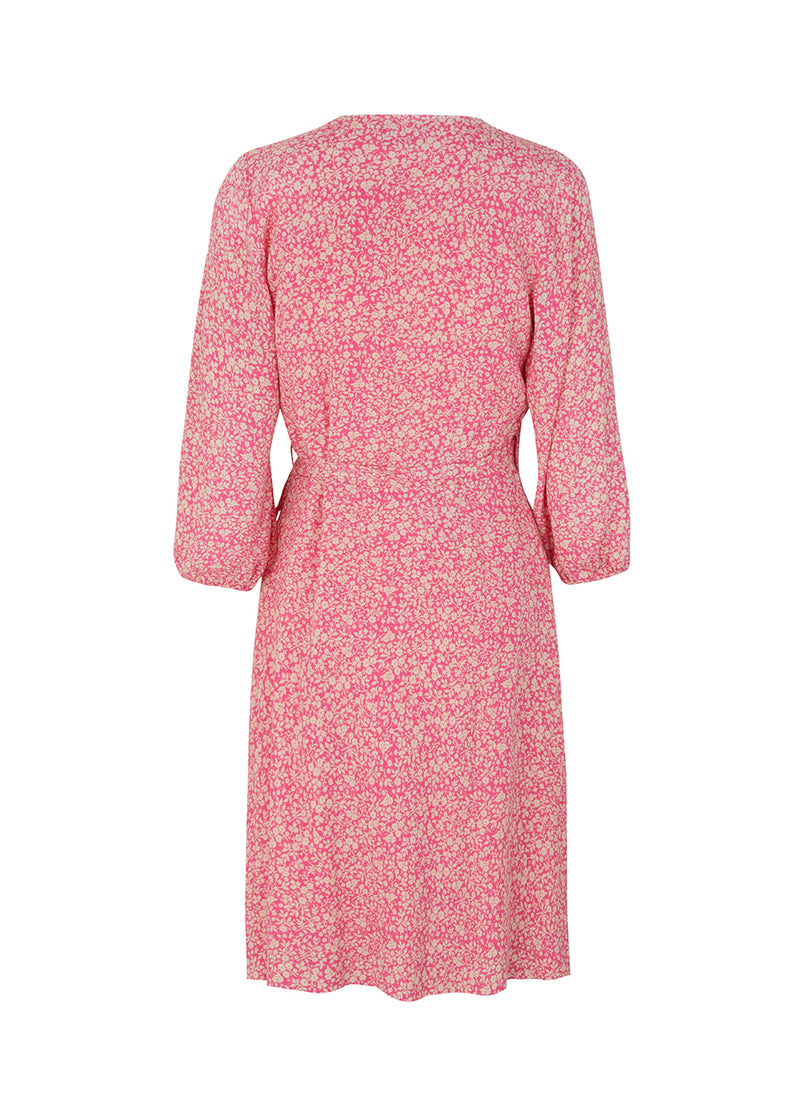Beautiful wrap dress in pink with print. RinnaMD print wrap dress is made in a more responsible quality and has fine details with ties and balloon sleeves.