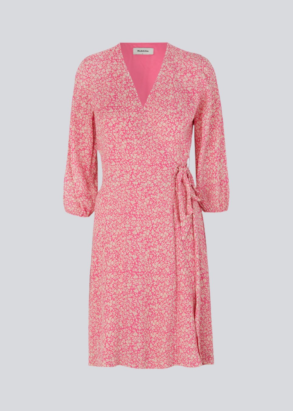 Beautiful wrap dress in pink with print. RinnaMD print wrap dress is made in a more responsible quality and has fine details with ties and balloon sleeves.