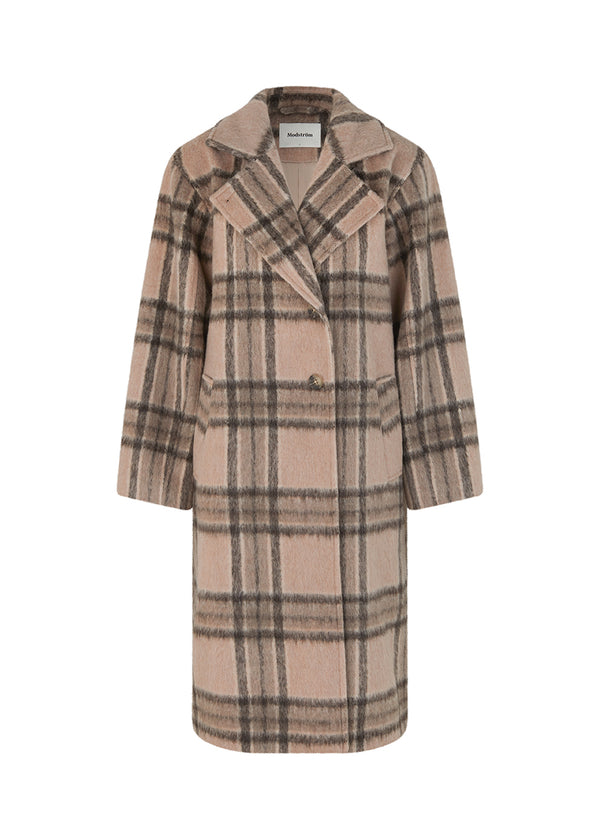 Coat in a soft, checked wool material with a relaxed fit and long, voluminous sleeves. In the color Atmosphere Check. SallieMD check coat is calf-length, has a collar and notch lapels with buttons down the front. Side pockets and single back vent. Lined.