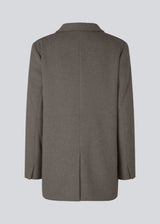 Blazer in brown with an oversized silhouette in a wool weave. SonnyMD jacket has a collar and notch lapels with two buttons in front and flap front pockets. Slit at sleeves and vent in back. Lined.