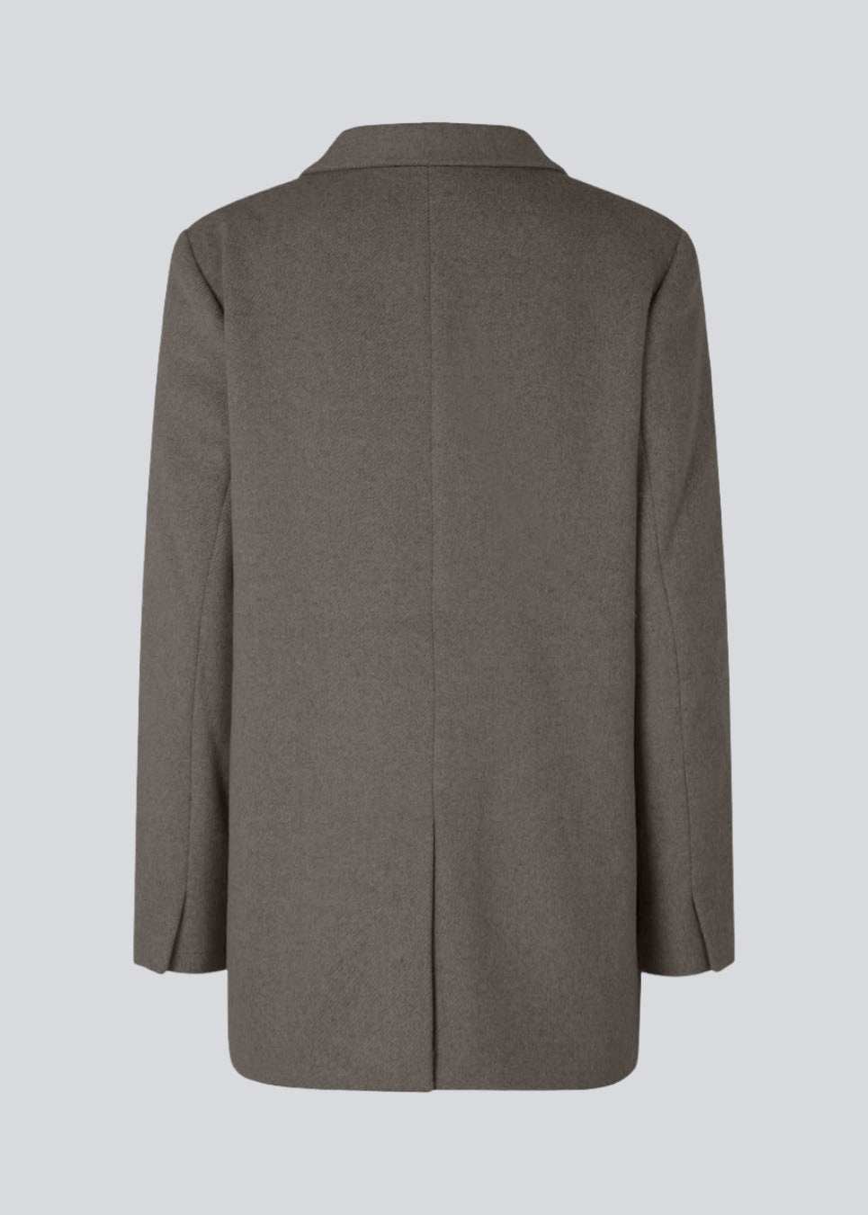 Blazer in brown with an oversized silhouette in a wool weave. SonnyMD jacket has a collar and notch lapels with two buttons in front and flap front pockets. Slit at sleeves and vent in back. Lined.
