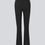 Nice pants in a soft quality with stretch. Tanny slit pants has a simple design with an elasticated waistline and a tight fit. The slit detail at the hem creates more width and effect at the bottom.