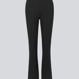 Nice pants in a soft quality with stretch. Tanny slit pants has a simple design with an elasticated waistline and a tight fit. The slit detail at the hem creates more width and effect at the bottom.