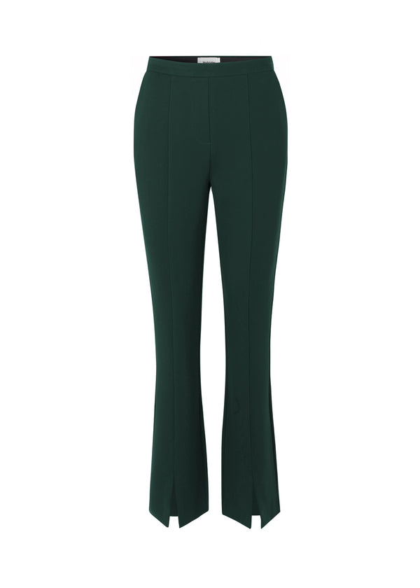 Nice pants in green in soft quality with stretch. Tanny slit pants have a simple design with an elasticated waistline and a tight fit. The slit detail at the hem creates more width and effect at the bottom. The model is wearing pants in black and is 173 cm. She wears a size S/36.