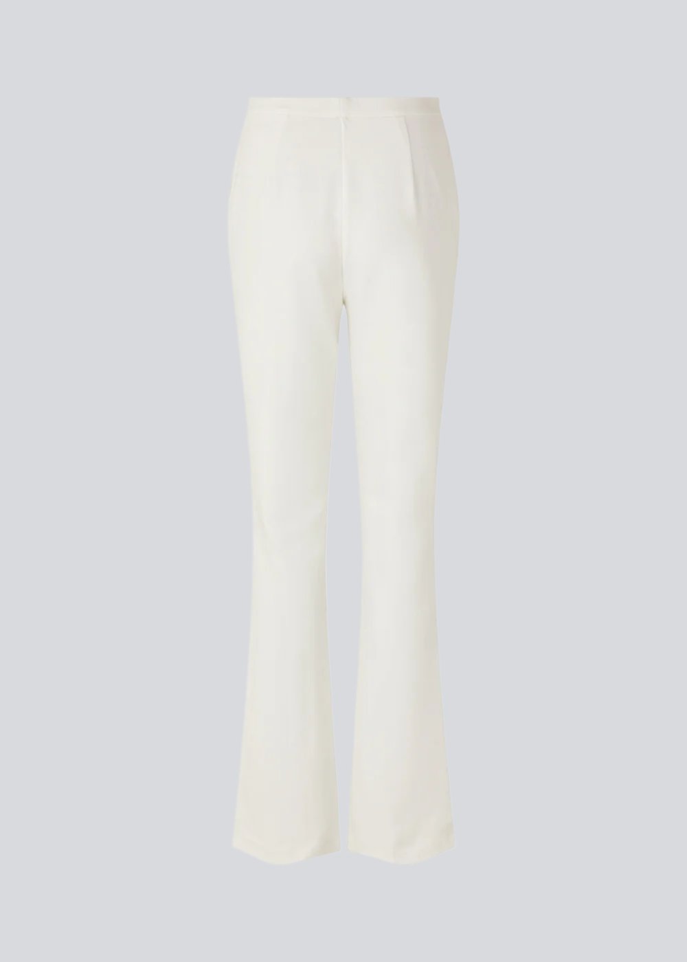 Nice pants in a soft quality with stretch. Tanny slit pants has a simple design with an elasticated waistline and a tight fit. The slit detail at the hem creates more width and effect at the bottom. The model is 173 cm and wears a size S/36