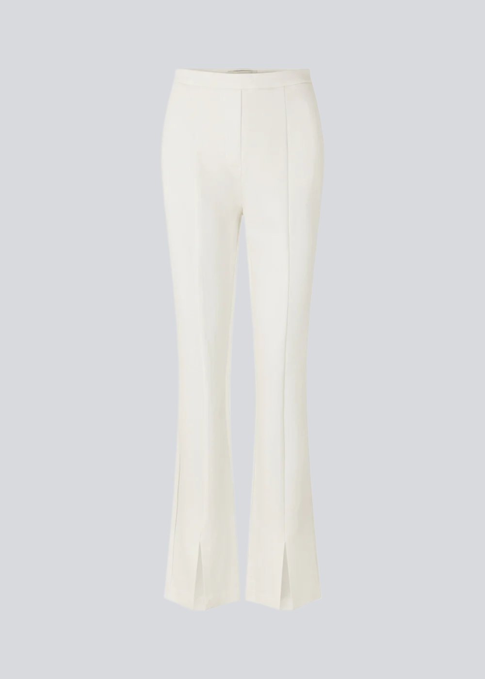 Nice pants in a soft quality with stretch. Tanny slit pants has a simple design with an elasticated waistline and a tight fit. The slit detail at the hem creates more width and effect at the bottom. The model is 173 cm and wears a size S/36