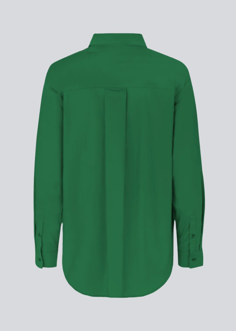 Airy shirt in green organic cotton poplin. TapirMD shirt has a collar and buttons in front, with an open chest pocket. Dropped shoulders and long sleeves with cuff and button. Embroidered logo in front.
