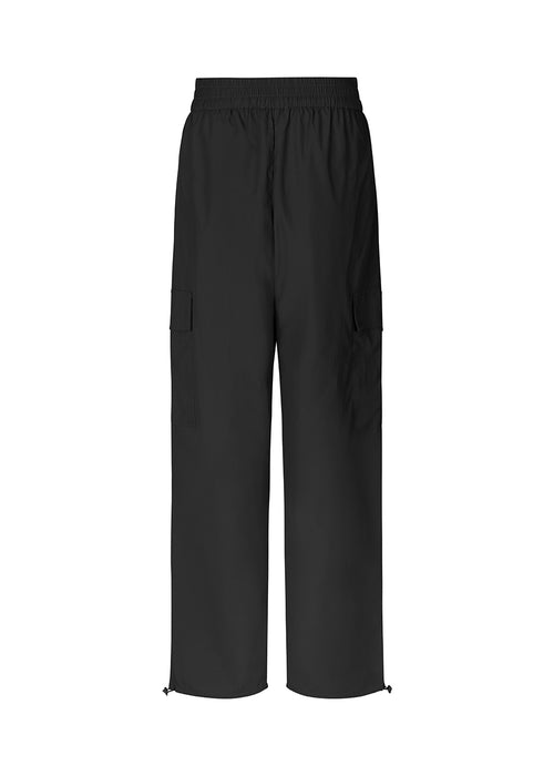 Cargo pants in nylon with elastic waistline and adjustable hems with elastic drawstrings. TrentMD pants have patch pockets on the legs. In black.  This is the same model as our popular pants AmayaMD pants. Just in a thicker material, perfect for fall and winter. 