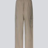 Cargo pants in nylon with elastic waistline and adjustable hems with elastic drawstrings. TrentMD pants have patch pockets on the legs. In Spring Stone.  This is the same model as our popular pants AmayaMD pants. Just in a thicker material, perfect for fall and winter. 