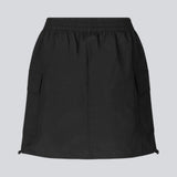 Short skirt in nylon with elastic waist and adjustable hems with elastic drawstrings. TrentMD skirt has two patch pockets and vertical cutlines on front and back.