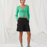Cargo shorts in black in nylon with wide legs. DilaraMD shorts have an elasticated waistband and two large patch pockets on the sides. The model is 177 cm and wears a size S/36.